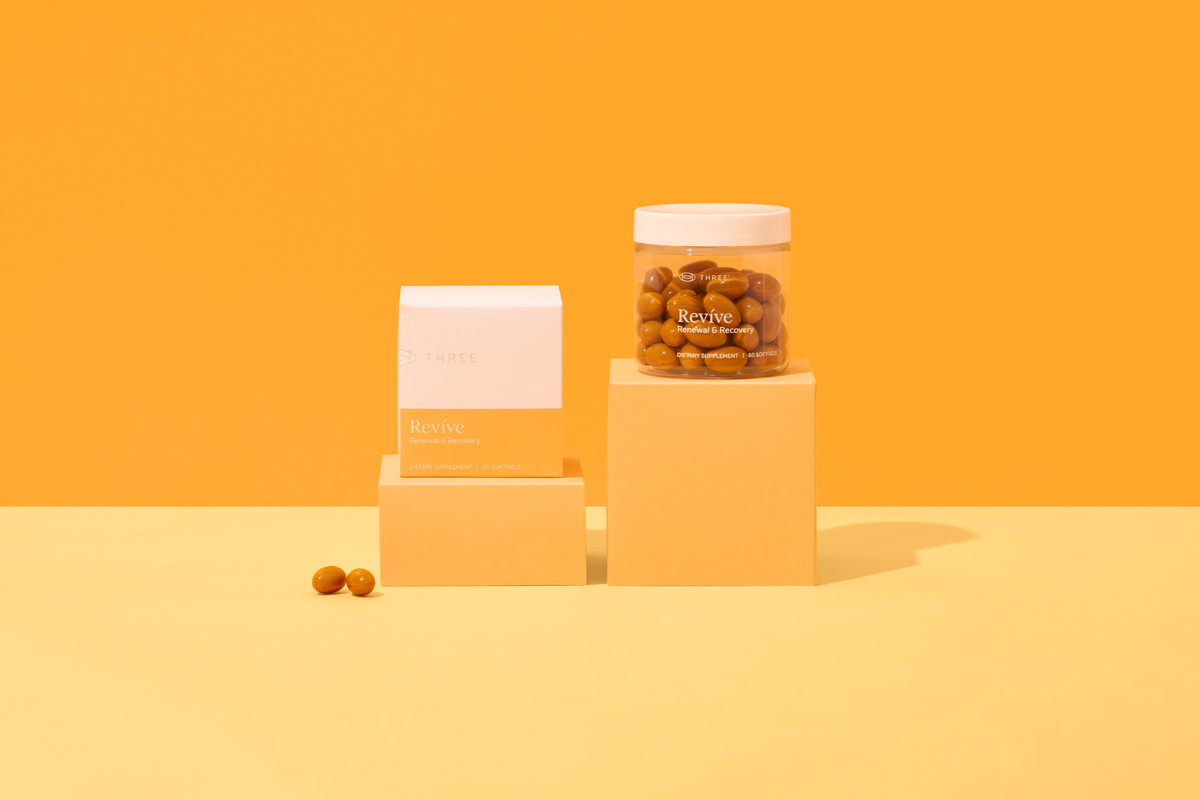revive by three sitting in a orange setting