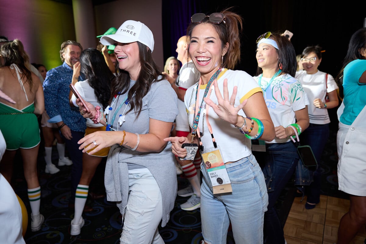 Smiling women walking into the 2024 THREE International Convention in Salk Lake City Utah